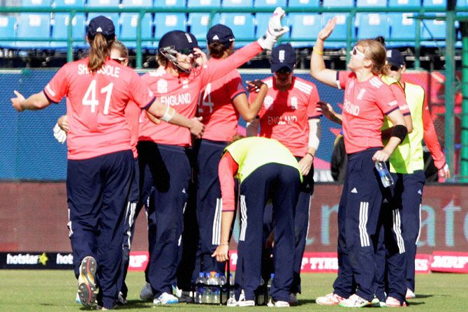 The England women's cricket team celebrate the dismissal of India's Shikha Pandey during their Womens T20 World Cup match at HPCA stadium in Dharamshala on Tuesday