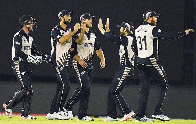 New Zealand players celebrate the wicket of Pakistan's Sharjeel Khan during their ICC World T20 match at PCA Stadium in Mohali on Tuesday
