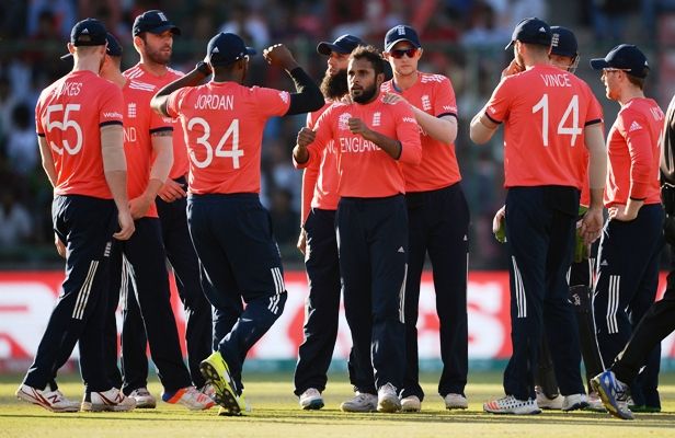 England's Adil Rashid celebrates with teammates after a dismissal