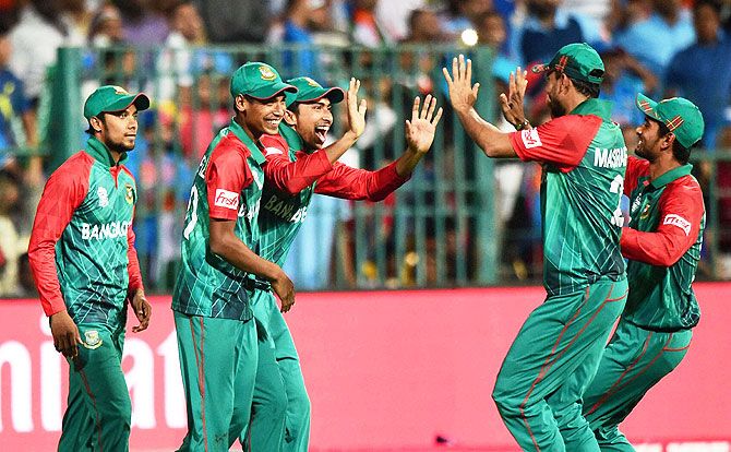 Bangladesh bowler Al Amin celebrate with teammates after claiming the wicket of India's Hardik Pandya