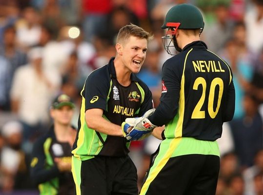 Adam Zampa and Peter Nevill of Australia celebrates after combining to take a wicket