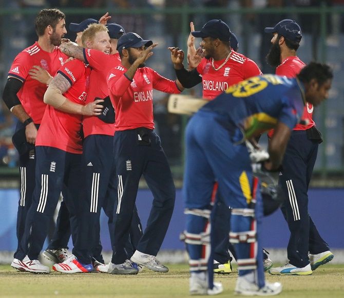 England's players celebrate after winning their match