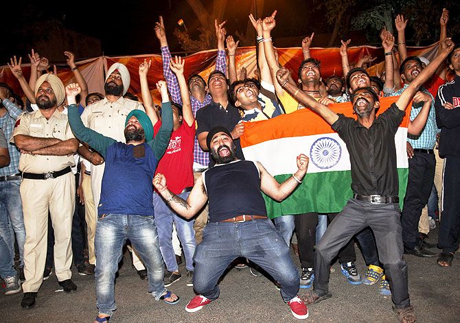 Fans celebrate after India beat Australia on Sunday