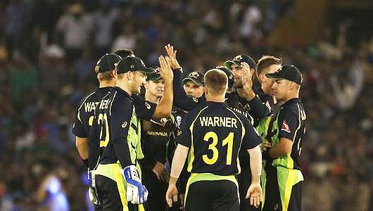 Australia's players celebrate the dismissal of India's Shikhar Dhawan on Sunday