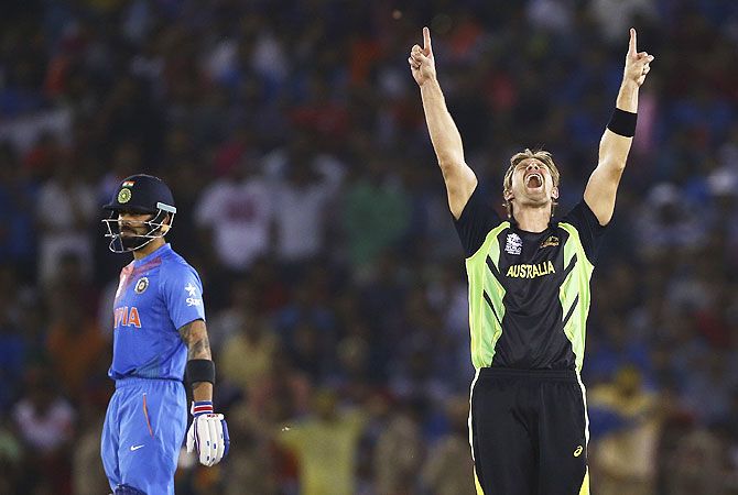 Australia's Shane Watson celebrates after taking the wicket of India's Rohit Sharma