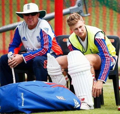 Coach Trevor Bayliss of England with Joe Root and captain Alastair Cook during a practice session