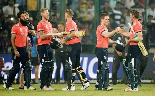 Jos Buttler and Joe Root celebrate with Ben Stokes and captain Eoin Morgan after winning the semi-final against New Zealand at the Feroz Shah Kotla. Photograph: Gareth Copley/Getty Images