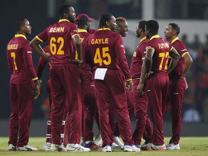 West Indies players celebrate the fall of a wicket during the ICC World T20 match against South Africa
