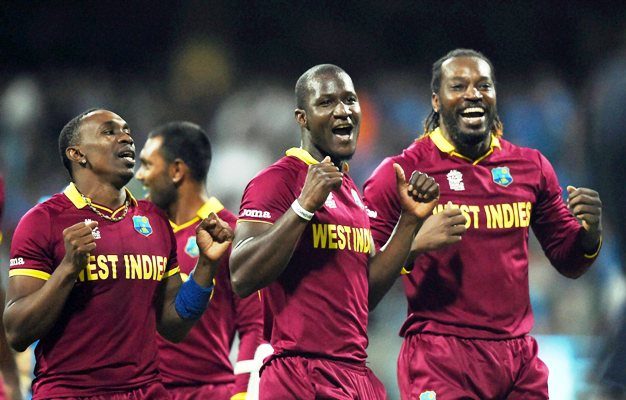 Dwayne Bravo, Darren Sammy and Chris Gayle celebrate after the West Indies beat England in the World T20 final.