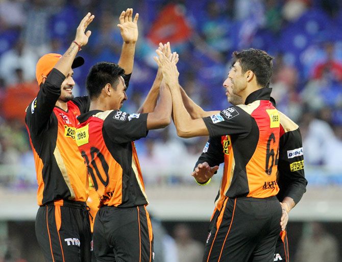 Sunrisers Hyderabad players celebrates the wicket of Mumbai Indians captain Rohit Sharma  during their Indian Premier League match in Visakhapatnam on Sunday