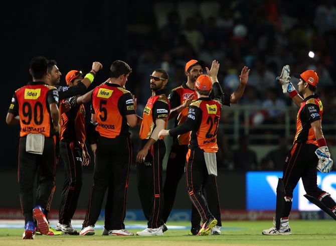 Sunrisers Hyderabad players celebrate the wicket of Kieron Pollard