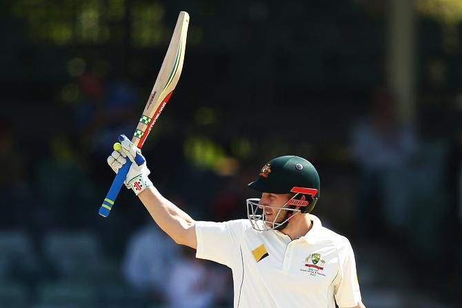 Australia's Peter Nevill celebrates his half century against South Africa on Day 5 of the first Test at the WACA in Perth