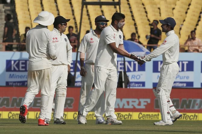India’s Umesh Yadav celebrates the wicket of Joe Root in the first Test at Rajkot