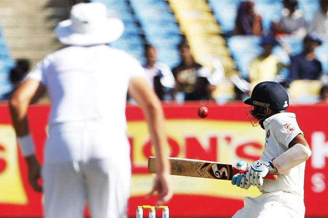 Cheteshwar Pujara avoids a bouncer during play on Day 3 