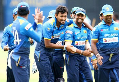Sri Lanka players celebrate after defeating Zimbabwe in the first ODI of the tri-series in Harare on Monday