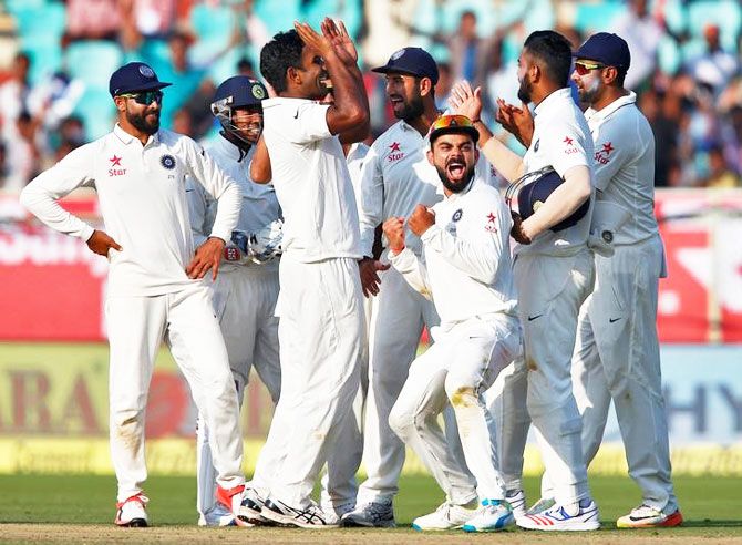 India's players celebrate with debutant spinner Jayant Yadav after the dismissal of England's Moeen Ali on Day 2 of the 2nd Test in Visakhapatnam on Friday