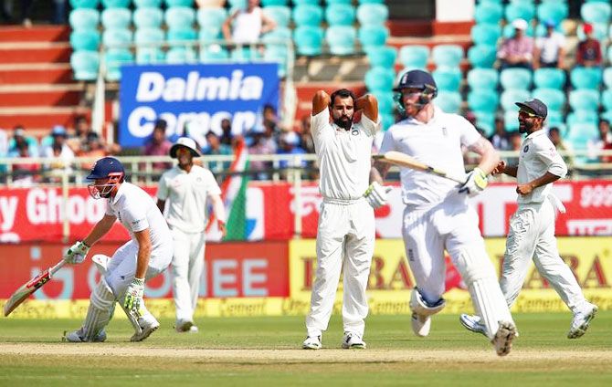 India's Mohammed Shami (centre) reacts as England's Ben Stokes (2nd from left) and Jonny Bairstow (left) run between wicket