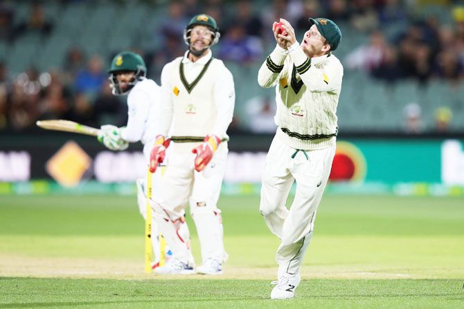Australia's Steve Smith takes a catch to dismiss South Africa's Temba Bavuma off the bowling of Nathan Lyon
