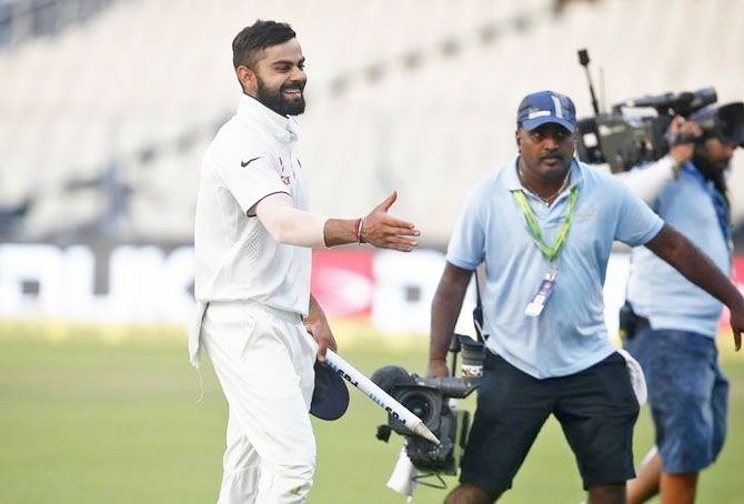 India's captain Virat Kohli celebrates after winning the match