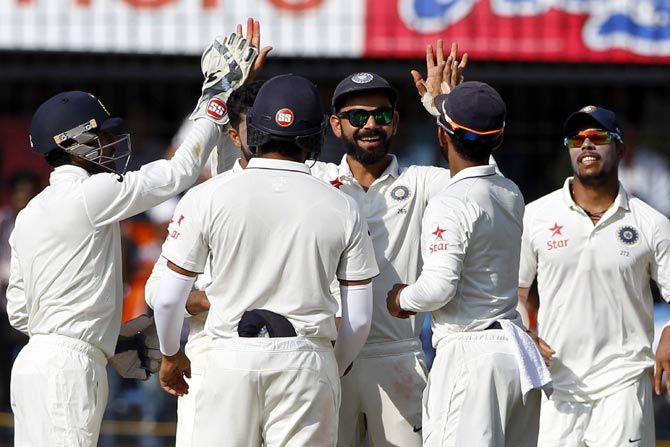 India players celebrate the wicket of New Zealand's Jimmy Neesham on Day 4 of the 3rd Test in Indore on Tuesday