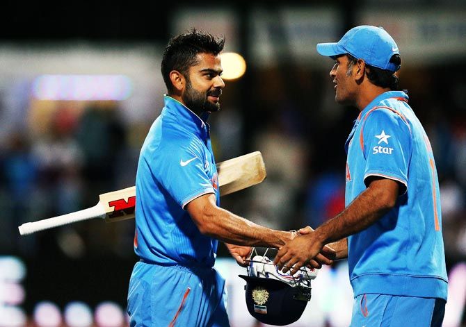 Virat Kohli, left, with Mahendra Singh Dhoni. Together, the Indian stars have scored over 16,000 ODI runs. Photograph: Hannah Peters/Getty Images