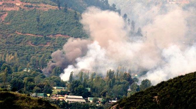 Smoke rises from the Uri Brigade camp during the terror attack