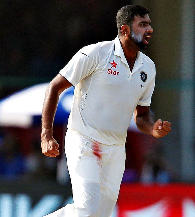 Ravichandran Ashwin celebrates after taking the wicket of New Zealand's Kane Williamson