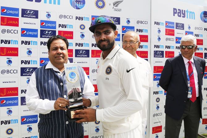 India's Ravindra Jadeja receives the Man of the Match Award during the presentation ceremony on Day 5 of the first Test in Kanpur on Monday