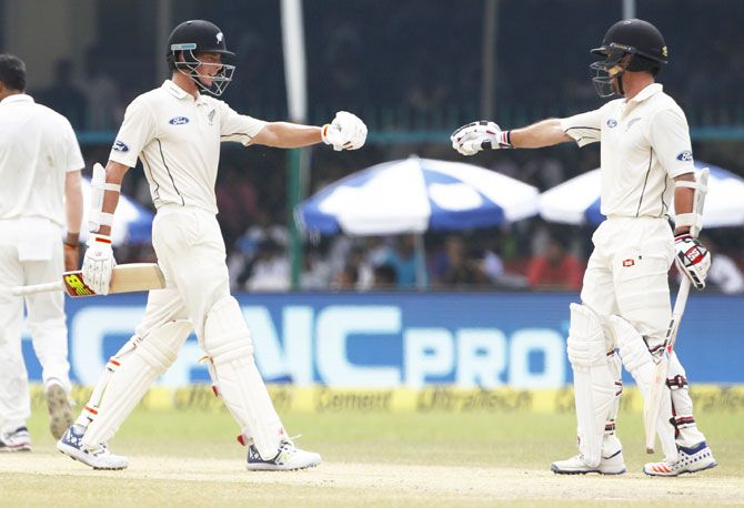 New Zealand's Luke Ronchi and Mitchell Santner pump fists during their 102-run partnership