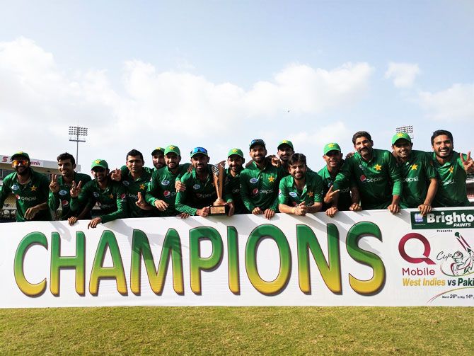 The Pakistan cricket team celebrate with the trophy after defeating West Indies in the fourth and final T20 to win the series 3-1
