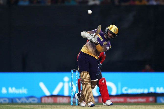 Kolkata Knight Riders' Sunil Narine  hits over the top for a six during his innings of 34 during the Indian Premier League match against Royal Challengers Bangalore at the Eden Gardens Stadium in Kolkata, on Sunday