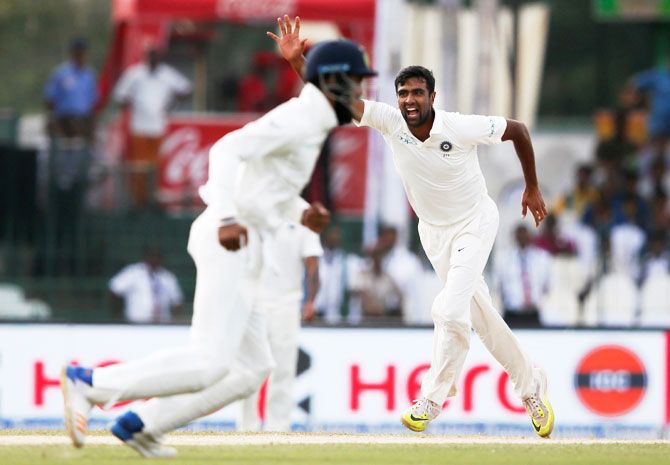 India's Ravichandran Ashwin and Lokesh Rahul celebrate after taking the wicket of Sri Lanka's Upul Tharanga
