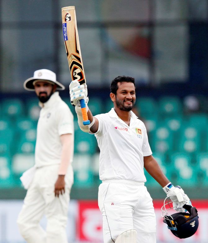 Sri Lanka's Dimuth Karunaratne celebrates his century against India