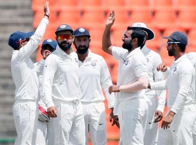 India's players celebrate the wicket of Upul Tharanga