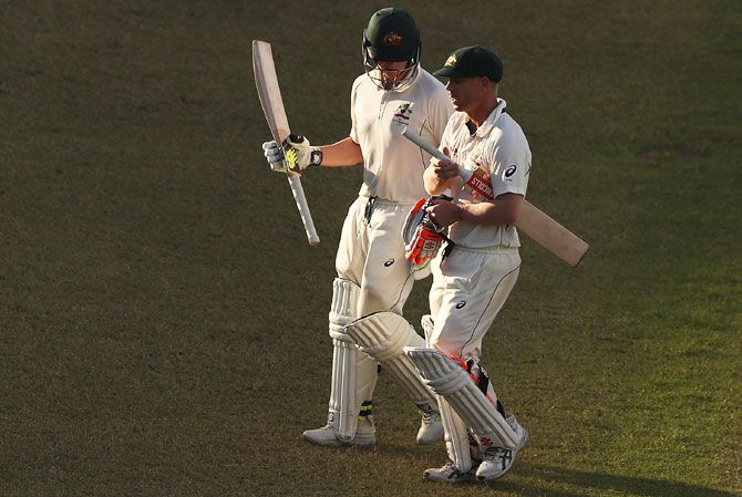 Australia's Steve Smith and David Warner walk off at the end of play on Day 3 of the First Test against Bangladesh at Shere Bangla National Stadium in Mirpur, on Tuesday