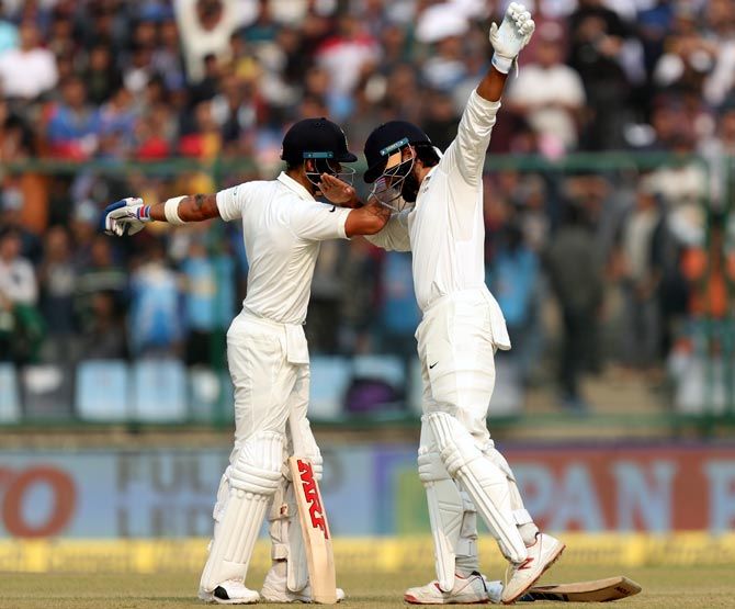 Murali Vijay, right, celebrates his century with captain Virat Kohli as they do the 'Dab' dance on Day 1 of the 3rd Test in New Delhi on Saturday