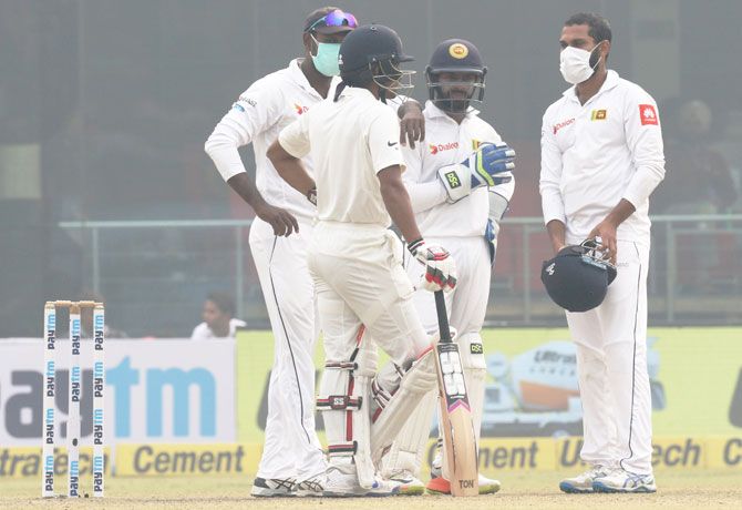 Sri Lanka players in discussion with India's Wriddhiman Saha