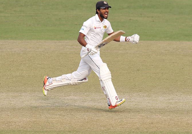 Sri Lanka captain Dinesh Chandimal celebrates on scoring his century