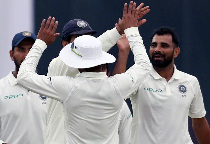 India's Mohammed Shami celebrates with teammates after claiming the wicket of Sri Lanka's Sadeera Samarawickrama on Day 4 of the 3rd Test in New Delhi on Tuesday