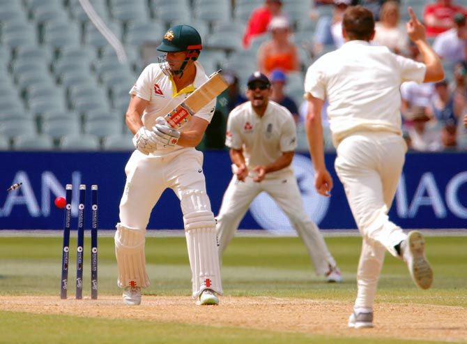 Australia's Shaun Marsh is bowled by England pacer Chris Woakes during day four of the second Ashes Test at the Adelaide Oval in Adelaide on Tuesday
