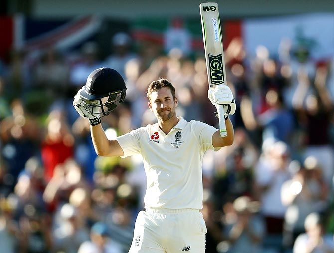 Dawid Malan celebrates after completing his century