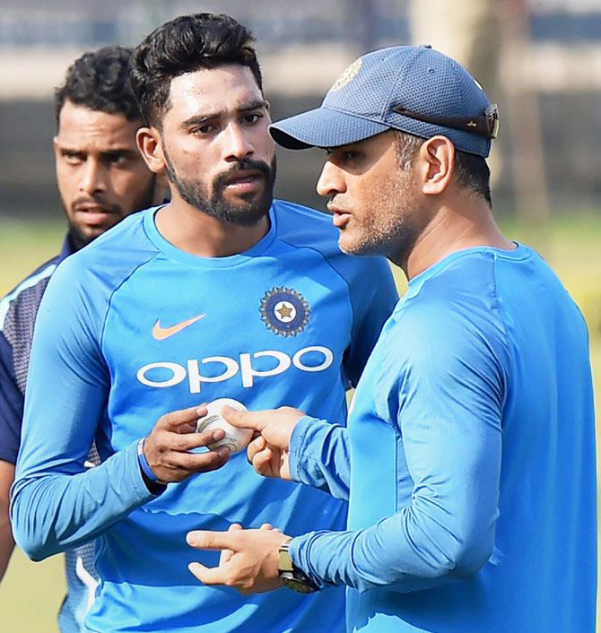 India's medium pacer Mohammad Siraj in discussion with Mahendra Singh Dhoni at the nets in Cuttack on Tuesday