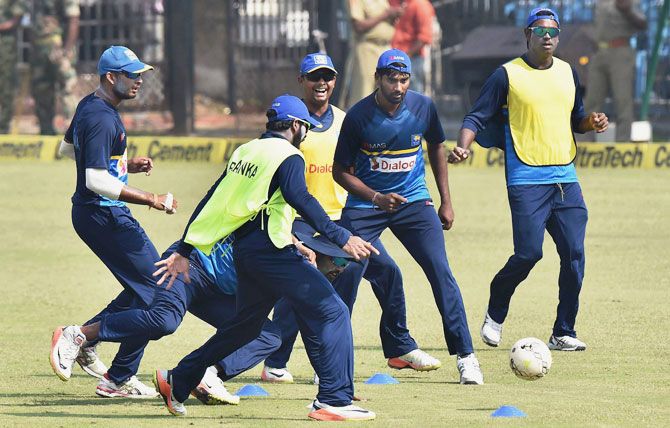 Sri Lankan cricketers play football during a practice session at Barabati Studium in Cuttack on Tuesday, the eve of the 1st T20 cricket match against India