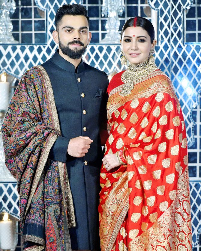 Virat Kohli and wife Anushka Sharma at their wedding reception in New Delhi on Thursday