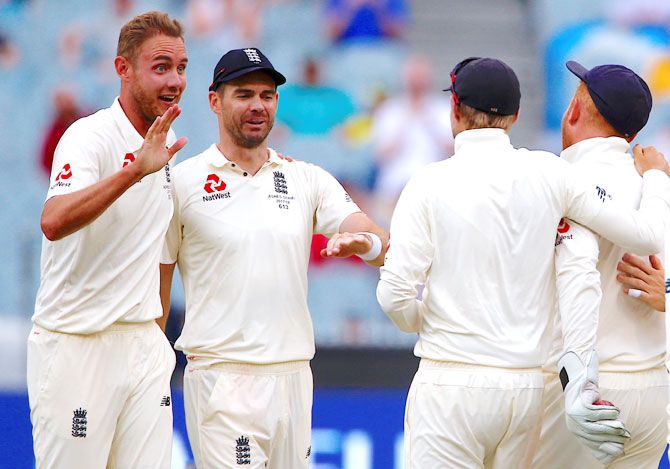 England's Stuart Broad celebrates with teammates after dismissing Australia's Shaun Marsh