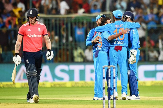England opener Jason Roy walks back as India players celebrate his dismissal during the 3rd T20 at Chinnaswamy Stadium in Bengaluru on Wednesday