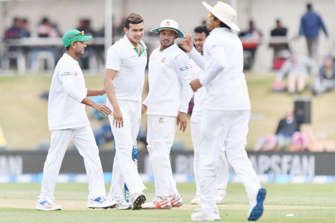 Bangladesh's Taskin Ahmed is congratulated by teammates after dismissing New Zealand's Tom Latham during their recently concluded Test series on January 21, 2017 in Christchurch, New Zealand. 