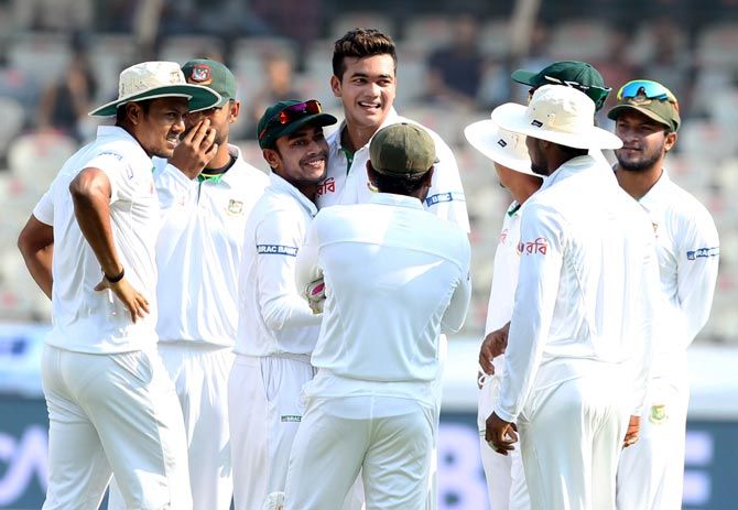Bangladesh pacer Taskin Ahmed celebrates with teammates after dismissing KL Rahul