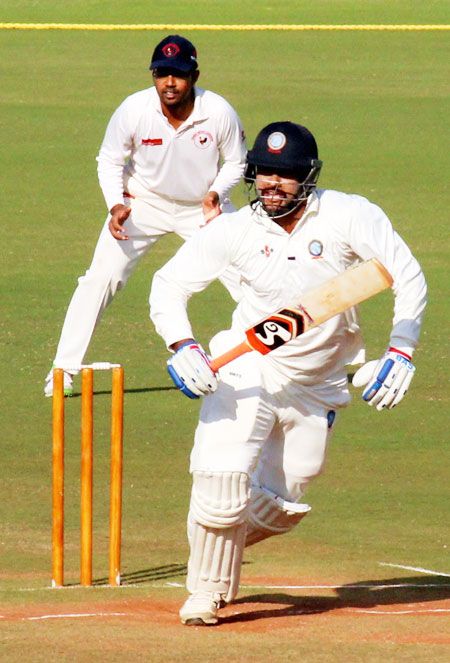 Jharkhand captain Saurabh Tiwary takes a run during the Ranji Trophy semi-final match against Gujarat at VCA stadium in Nagpur on Monday