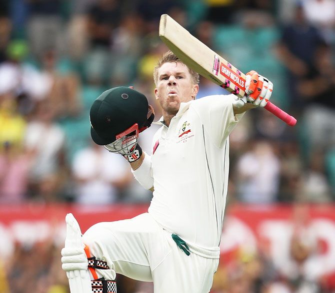 David Warner celebrates his century against Pakistan in Sydney, January 3, 2017. The opener became the first Australian since Sir Don Bradman to smash a ton before lunch on the first day of a Test. Photograph: Mark Kolbe/Getty Images